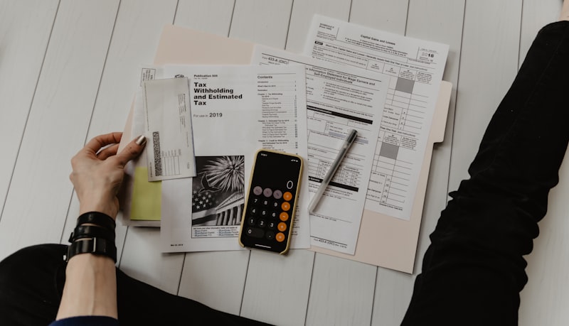 Calculator and paperwork laid out on a table